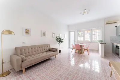 a living room with a couch and a table at Retrò Loft Ponte Milvio, Nearby Foro Italico in Rome