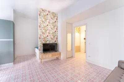 a living room with a tv on a wall at Retrò Loft Ponte Milvio, Nearby Foro Italico in Rome