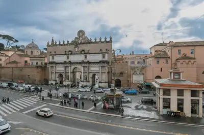 a city street with cars parked in front of a building at EFFE 9 FLAMINIO Guest House in Rome-Vatican City in Rome
