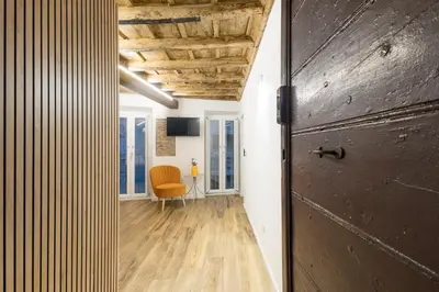 a hallway with a door and a chair in a room at Boutique Atrium Pantheon in Rome