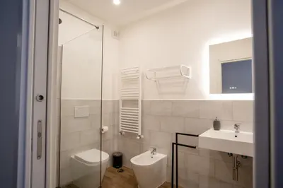 a bathroom with a toilet and a sink at VT Cola di Rienzo Elegant Suites in Rome