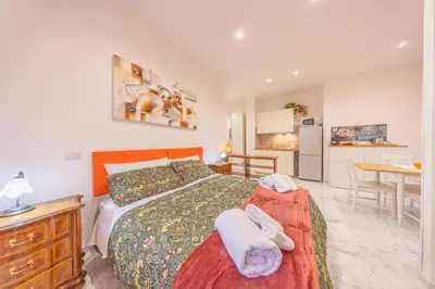 a bedroom with a bed with towels on it at vaticanloft for you in Rome