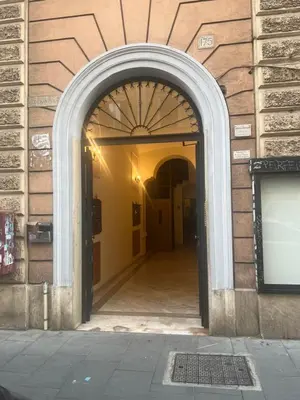 a kitchen with a large stainless steel refrigerator at B&B Lorenzo 7HillsRoma in Rome