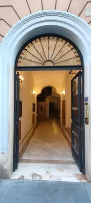 an entrance to a building with an archway at B&B Lorenzo 7HillsRoma in Rome