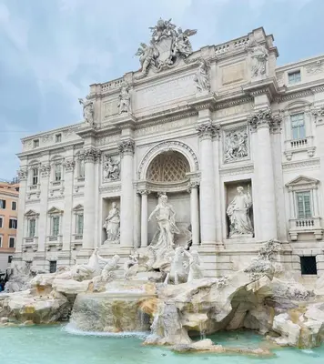 a building with a fountain in front of it at MaLoMA Home intero alloggio fronte metro A in Rome