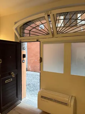 an empty room with a door and a window at The Hatters Inn in Rome