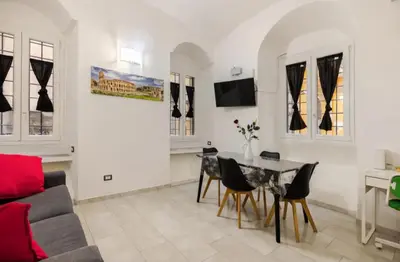 a living room with a couch and a table at La Casetta Sabelli In the center of Rome in Rome