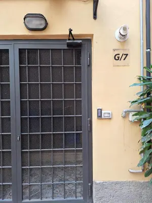 a door to a house with a sign at La Casetta Sabelli In the center of Rome in Rome