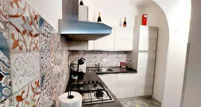 a small kitchen with a sink and a stove at La Casetta Sabelli In the center of Rome in Rome