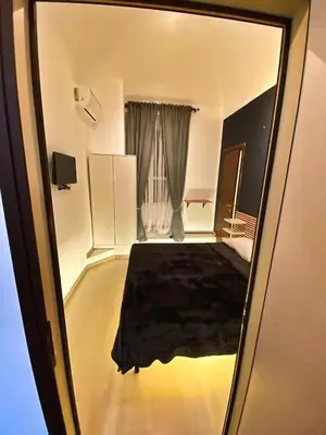 a view of a room with a bed and a window at Cialdini 13 Roma in Rome