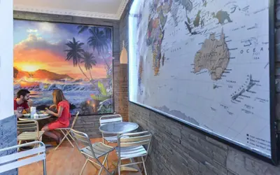 a hotel room with two beds and a window at Ogbay Backpackers Haven in Rome