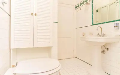 a bedroom with two beds and a mirror at Ogbay Backpackers Haven in Rome