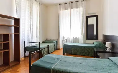 a bathroom with two sinks and a large mirror at Ogbay Backpackers Haven in Rome