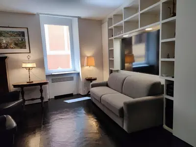 a living room with a couch and a window at Banchi Nuovi Ventuno in Rome
