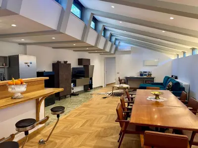 an office with a long table and chairs at Caracalla Loft in Rome