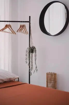 a bedroom with a mirror and a bed at Casetta in Rome