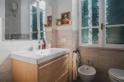 a bathroom with a sink and a toilet at Casetta in Rome