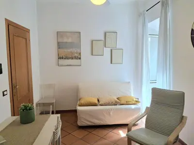 a living room with a couch and a chair at Candia 66 at the Vatican Museums in Rome