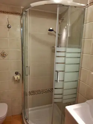 a shower with a glass door in a bathroom at Candia 66 at the Vatican Museums in Rome