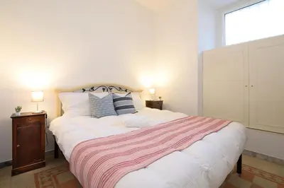 a bedroom with a large bed and a window at Salotto19 - Villa Borghese in Rome