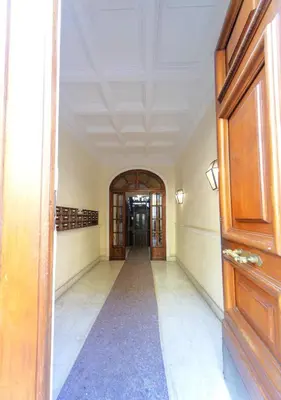 an empty hallway with a door in a building at Palumbo 12 Holiday Home in Rome