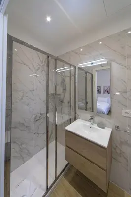 a bathroom with a sink and a shower at Palumbo 12 Holiday Home in Rome