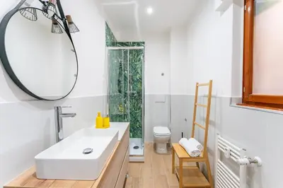 a bathroom with a white sink and a mirror at Domus Citro, Cozy Flat in District Prenestina in Rome