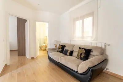 a living room with a couch and a window at Domus Citro, Cozy Flat in District Prenestina in Rome