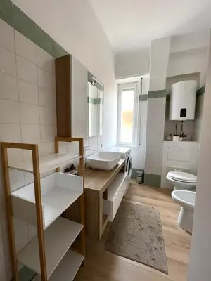 a bathroom with a sink and a toilet at Numa House in Rome