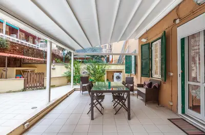 an outdoor patio with a table and chairs at Vacanze Romane con giardino in Rome