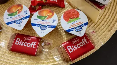 a group of three packages of biscuits and a strawberry at Casa Maria Teresa by Rentbeat in Rome