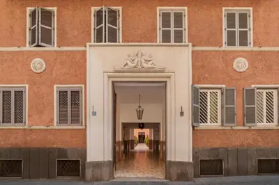 an internal courtyard of a building with plants at GuestHost - San Giovanni Laterano Apartment in Rome
