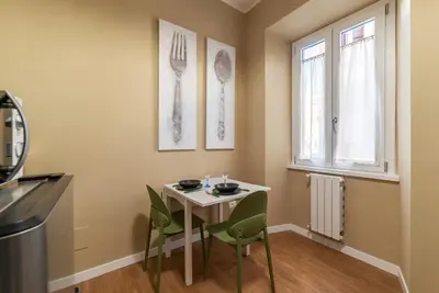a bedroom with a bed and a tropical wall at GuestHost - San Giovanni Laterano Apartment in Rome