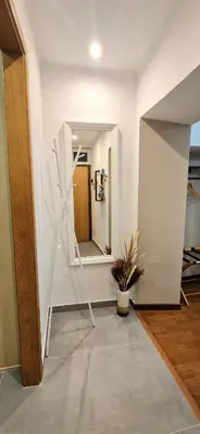 a room with a hallway with a stair case at Elegant Suite Colosseo in Rome