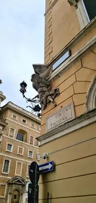 a street sign on the side of a building at Elegant Suite Colosseo in Rome