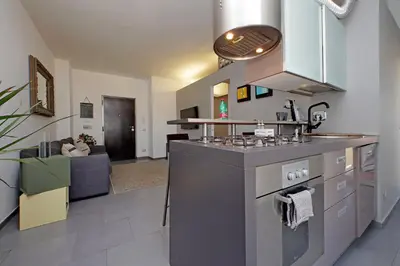 a kitchen with a sink and a stove top oven at Manzoni in Rome