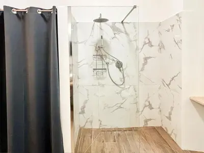 a shower with a black shower curtain in a bathroom at RomeAsYouLike-Esquilino Apartment N 86 in Rome