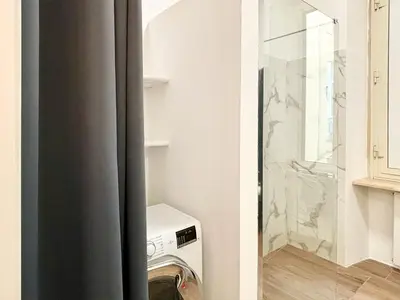 a laundry room with a washer and a glass door at RomeAsYouLike-Esquilino Apartment N 86 in Rome