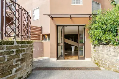 an entrance to a house with a brick wall at La Piccola Luxury Suite in Rome