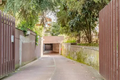 an empty alley with a tunnel in the distance at La Piccola Luxury Suite in Rome