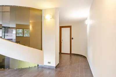 an empty room with a staircase and a hallway at La Piccola Luxury Suite in Rome