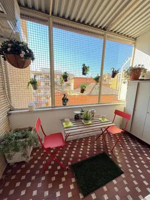 a patio with a table and two chairs in a room at Gianicolo Trastevere Exclusive Apartments in Rome