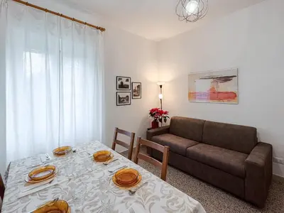 a living room with a couch and a table at Domus Valle Aurelia - Vaticano - Metro Linea A in Rome