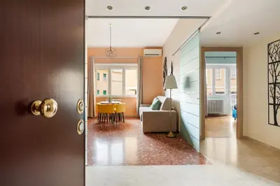 a hallway with a living room and a dining room at Monteverde Private Terrace in Rome