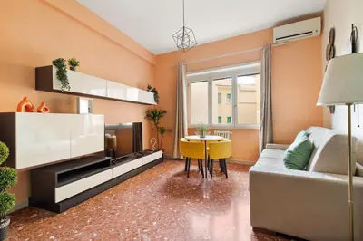 a living room with a couch and a table at Monteverde Private Terrace in Rome