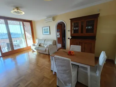 a living room with a table and a couch at F&F Rome Apartment - 2 Bedrooms Aurelio Boccea in Rome