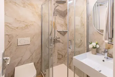 a bathroom with a shower and a toilet and a sink at 94Rooms Roma Nord - Flaminia in Rome