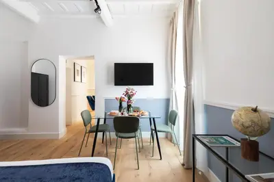 a dining room with a table and chairs at Palomba Boutique Apartment in Rome