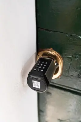 a remote control is attached to a door handle at Palomba Boutique Apartment in Rome