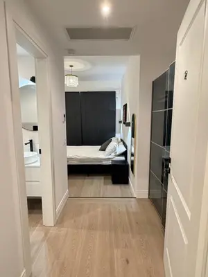 a small room with a bed and a mirror at Vita Lux Vatican Suites in Rome